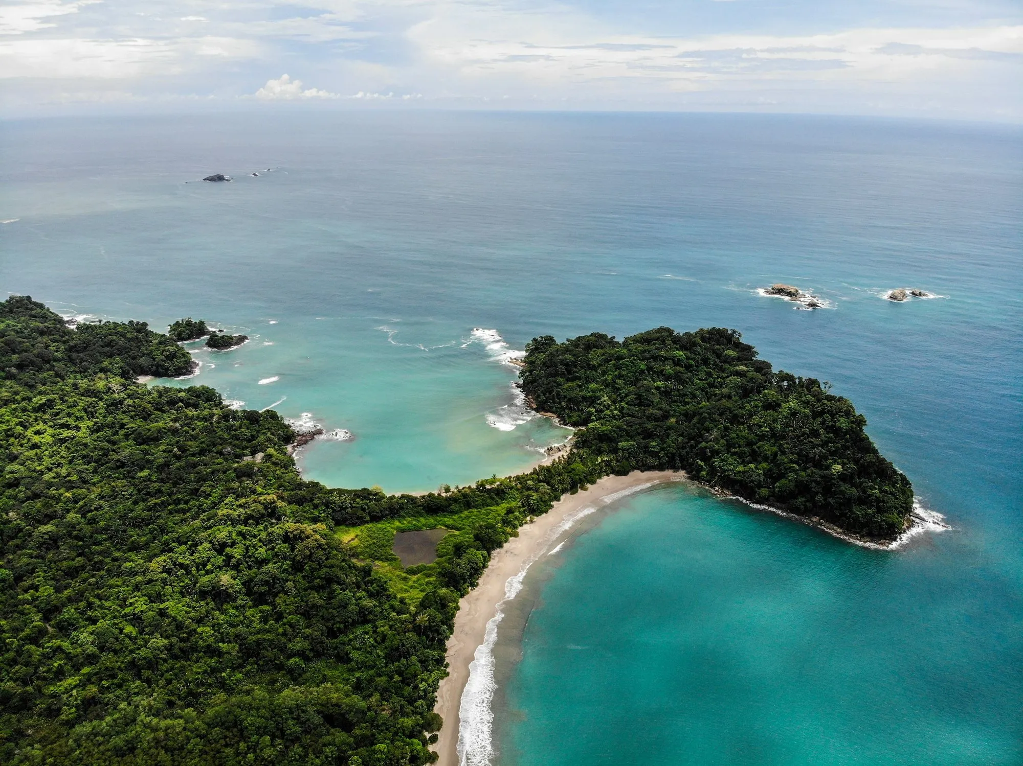 Aerial view of the forested headland and beaches of Manuel Antonio National Park